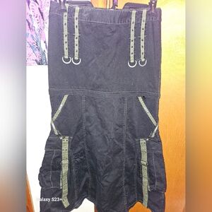 Tripp black with camo green accents, convertible skirt.